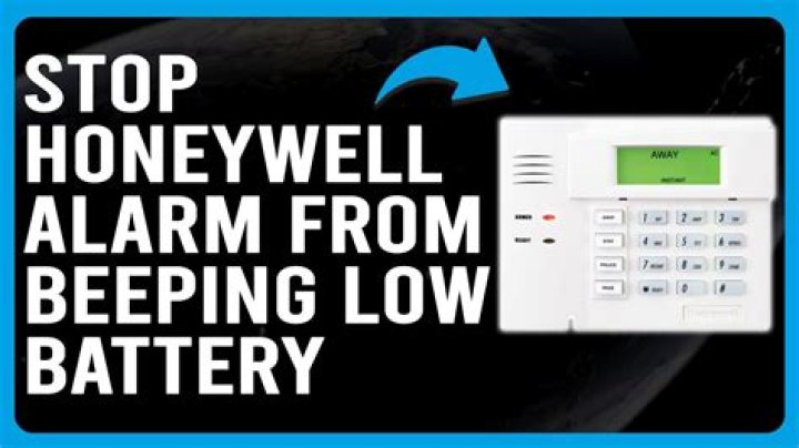 How do I stop my DSC alarm from beeping Low battery?