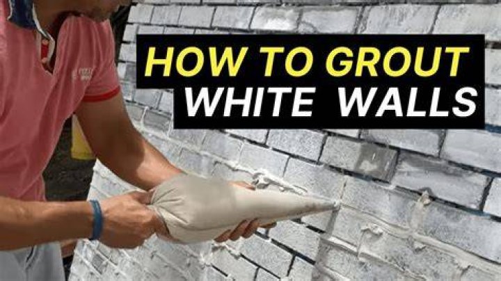 How do you smooth grout lines?